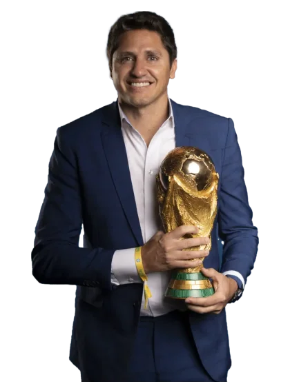 Edmilson in a suit holding the World Cup trophy